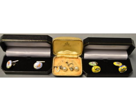 A pair of silver cufflinks, each with two oval panel terminals, decorated with a Ballet dancer, and Wine,  Racehorse and Play
