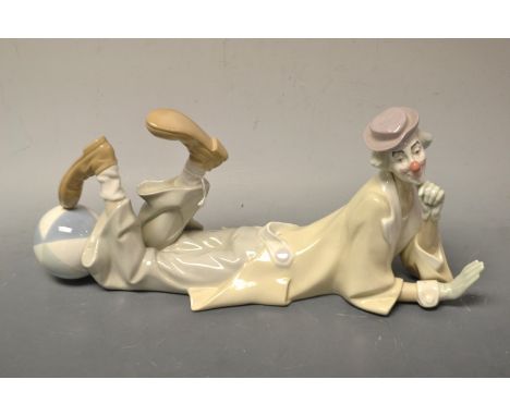 A Lladro figure of a playful clown 