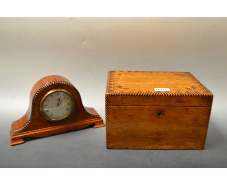 A burr walnut French mantel clock, 28cm wide, 17cm high; an oak marquetry inlaid box and cover (2)