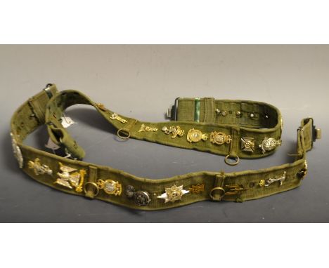 Two army belts. mounted badges