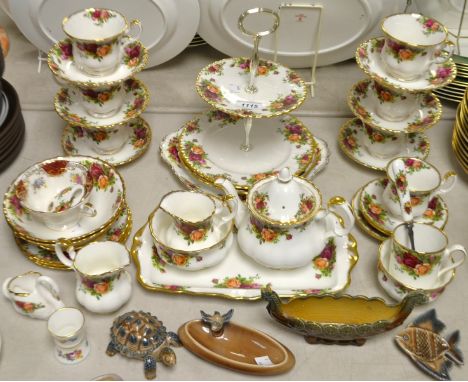 A Royal Albert Old Country Roses pattern table service, including two tier cakestands, small teapot, cups, saucers, tray, bow