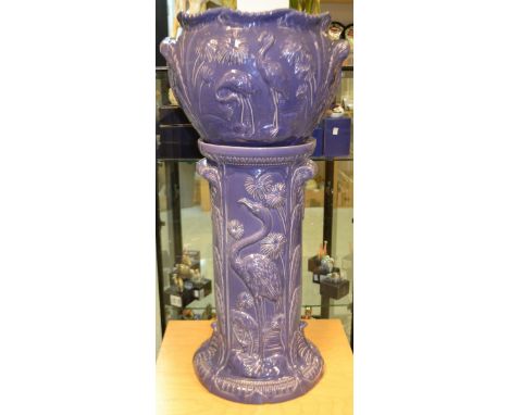 An Ault pottery jardiniere and stand, storic purple.