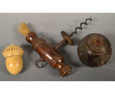 A 19th century lignum vitae puzzle snuff box, decorated with draught turned roundels, c.1860;  a 19th century cork screw;  a 