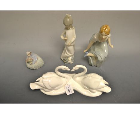 A Royal Doulton model Endless love ; a Royal Dux figure of a lady ; ; a Lladro figure of a lady holding a basket of flowers ;