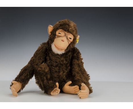 A good Steiff Jocko monkey, 1950s, with brown mohair, clear and black glass eyes with brown packs, felt fact, ears, hands and