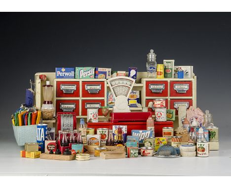 A German toy grocery shop, 1950s, painted cream wood with red drawers and counter, scales and cash register and a large quant