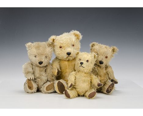 Four plastic nosed Chiltern Hugmee teddy bears, with golden and blonde mohair, orange and black plastic eyes, fully jointed, 