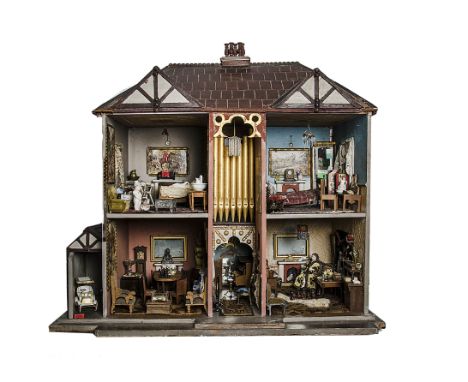 Millfield, an American carpenter built dolls’ house with built-in pipe organ, with grey painted façade with transfer printed 