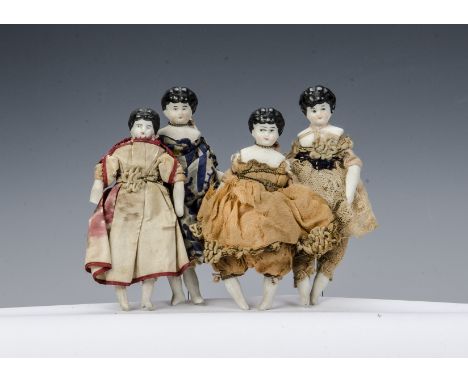 Four bisque shoulder-head dolls’ house dolls, with painted black hair, cloth bodies and bisque lower limbs, some original clo