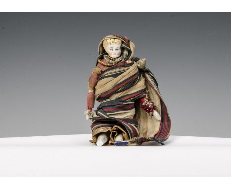 An interesting dolls’ house Anglo-Indian doll wearing sari, bisque shoulder head with moulded blonde hair, stuffed cloth body