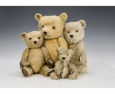 Four post-war Chiltern Hugmee teddy bears, two with blonde mohair, two with golden mohair, orange ad black glass eyes, black 
