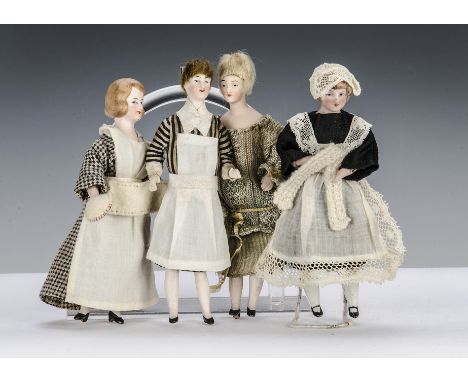 Four German bisque shoulder-head dolls’ house dolls, one in original nanny outfit with full bisque bust, articulated bent arm