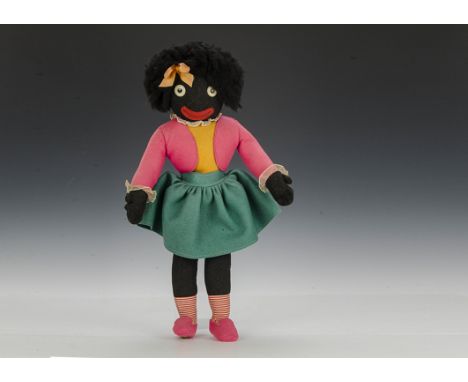A Dean’ Rag Book Co. girl Golliwog, of felt with plastic googlie eyes, black nylon hair, pink, yellow and green outfit with i