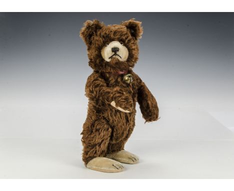 A rare Steiff Teddy Baby with unusual closed mouth, 1930s, with brown mohair, clear and black glass eyes with brown painted b