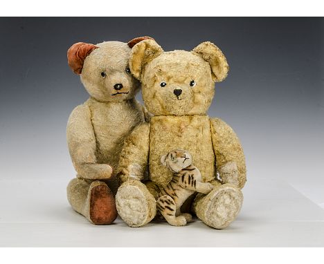 Two teddy bears and a Steiff tiger: a golden mohair bear, possibly French with clear and black glass eyes, pronounced muzzle,