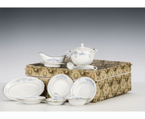 A boxed enamel doll’s dinner service, white with blue and gilt Art Nouveau edging, in original box (box a little damaged)