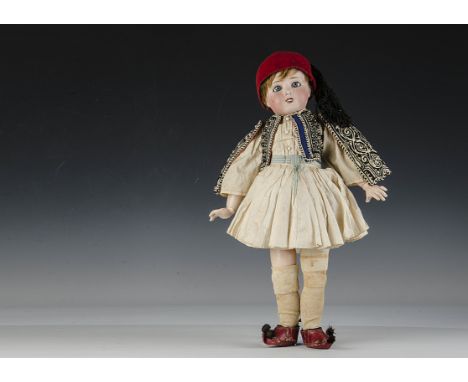 A Limoges child doll dressed as a Greek Evzone, with blue fixed eyes, light brown mohair wig, jointed paper-mache mache body,
