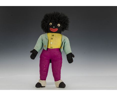 A Dean’ Rag Book Co. Golliwog, of felt with plastic googlie eyes with floating pupil, black nylon hair, yellow, turquoise and