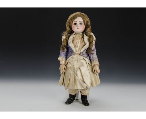 A fine Jules Steiner Series C bebe No.3, with fixed brown eyes, light brown feather brows, closed mouth, pierced ears, titian