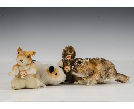 Steiff post-war small mammals: a Nagy beaver with script button, yellow cloth tag and chest tag - 4in. (10cm.) high; a lying 