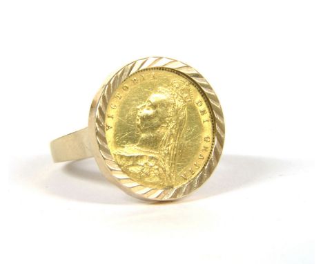 A 9ct gold Victorian half sovereign ring, with rose cut decoration to the mount, 9.09g