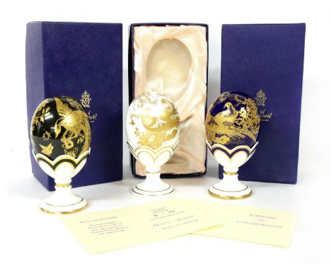 Three Royal Worcester gold Aves Faberge eggs, on stands, each numberd 71/500, commissioned by Wheelerss of Loughorough, with 