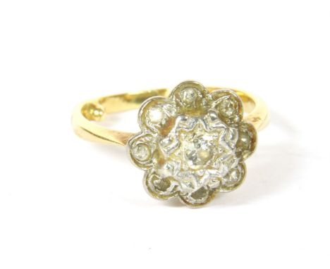 A gold diamond daisy cluster ring, tested as approximately 18ct gold, 3.37g