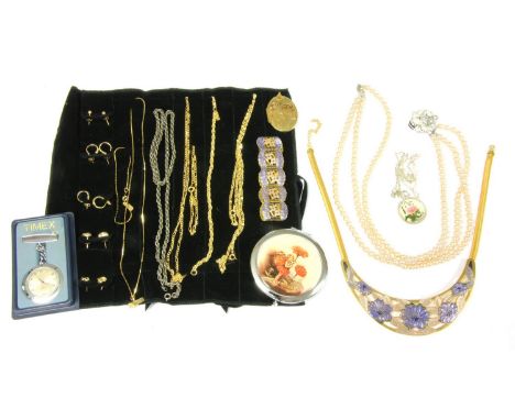 A large quantity of costume jewellery, to include a silver ingot, a blue past stone ring, gold plated chains, gilt metal earr