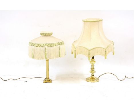 A quantity of lamps and light fittings , to include large brass column lamps, lanterns, shades etc