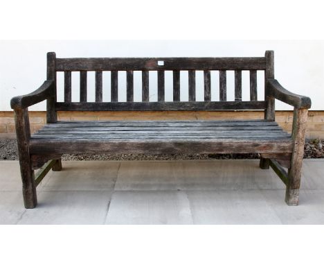 A teak garden bench , labelled 'made from wood from R.M.S. ARMADLE', 150.5cm wide