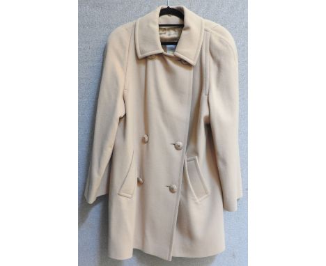 An Aquascutum mackintosh trench coat, and another similar in a light green colour, and two Aquascutum camel coloured cashmere