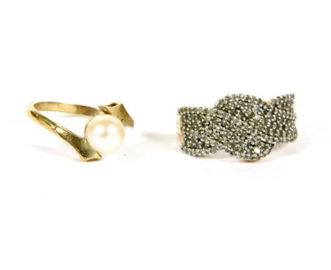 A 9ct gold pave set twisted ribbon design ring, 2.91g, and a 9ct gold single stone cultured pearl crossover ring, 1.93g