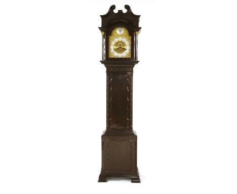 An Edwardian mahogany eight-day longcase clock, the brass arch dial with a musical gong strike movement, the swan neck hood a