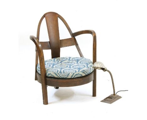 An Art Deco bentwood low chair, with a leather strap back, together with an early 20th century anglepoise lamp