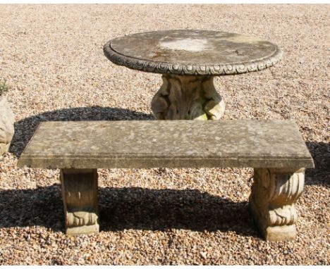 A circular reconstituted stone garden table , 94 cm diameter, a similar bench, 113 cm long, a metal ended bench, and a scroll