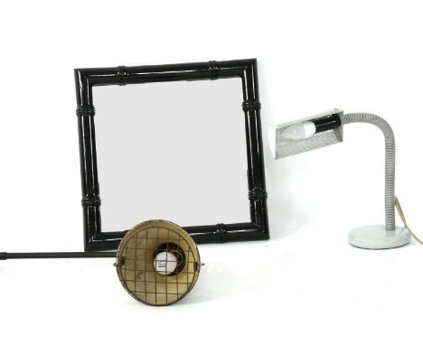 A faux bamboo ebonised mirror, an industrial wall light, and a 1980 desk lamp