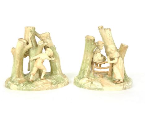 A pair of Royal Worcester spill vases, modelled as figure groups of children playing, impressed and printed marks, 16cm high 