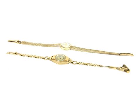 A ladies 9ct gold Tissot mechanical bracelet watch, silvered dial, gilt and black baton markers, to a textured 9ct gold brace