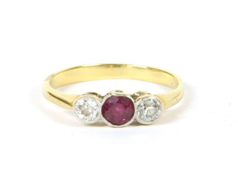 A gold three stone ruby and diamond ring, milligrain set to plain shoulders and a plain polished shank, 2.02g, size J, tested