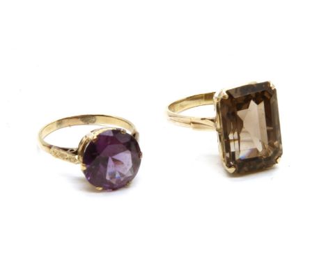 A gold single stone circular cut synthetic colour change sapphire ring, marked 14k, size P½, a gold single stone emerald cut 