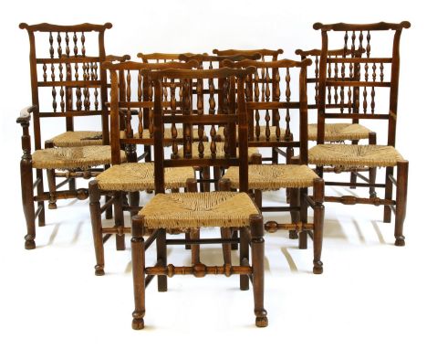 A harlequin set of ten Lancashire ladder back chairs, with rush seats (one with arms cut off)