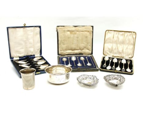 A collection of silver items, to include two pierced bon bon dishes, a bowl, three cased sets of spoons and an engine turned 
