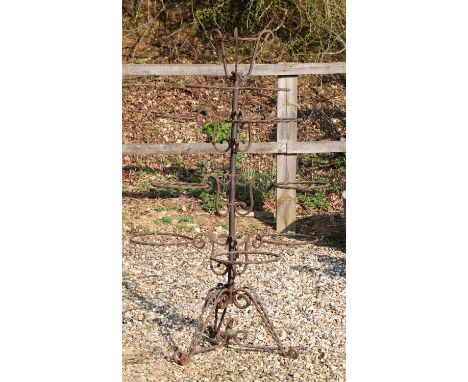 A wrought iron stand, with ring supports