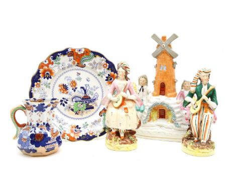 Five various Staffordshire figures, two ironstone jugs and nine ironstone plates and a dog, tallest 25.5 cm