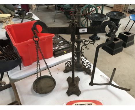 A Victorian copper and cast iron table oil lamp and a set of old vintage iron shop scales - incomplete