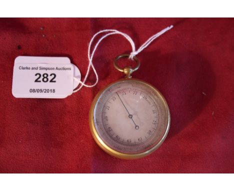 A small brass cased pocket barometer