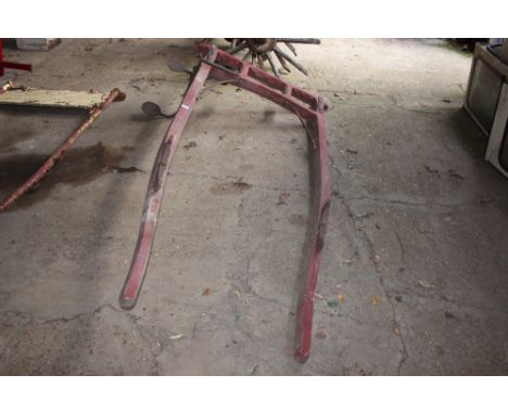 A pair of vintage wooden cart shafts with integral metal step 