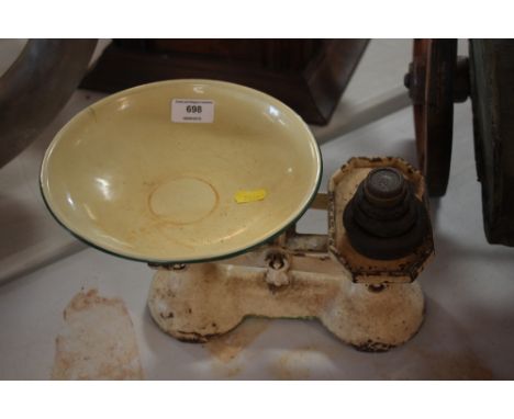 A set of cast iron and enamel kitchen scales and weights 
