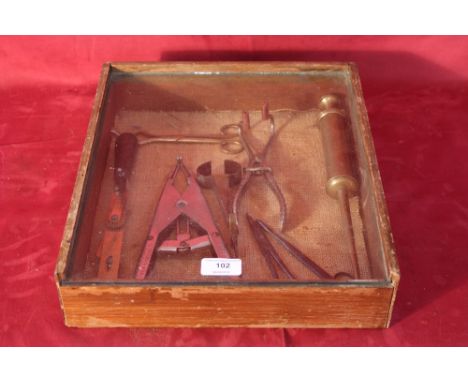 A cased collection of veterinary tools