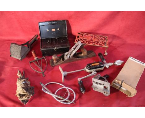 A box containing various tools; brass hearth stand; vintage grater; cash tin etc. 